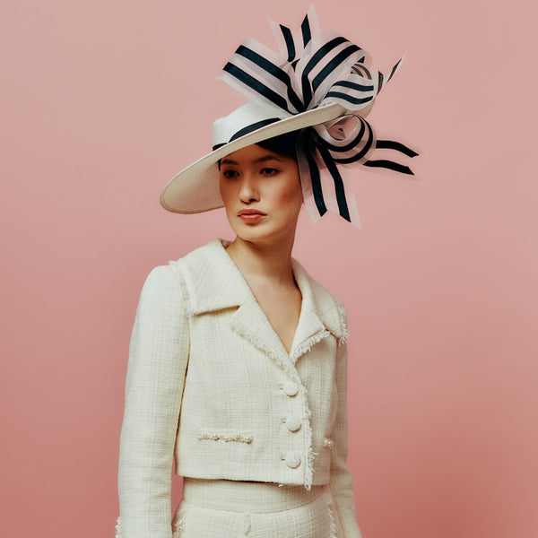 white straw slice fedora with black and white bow