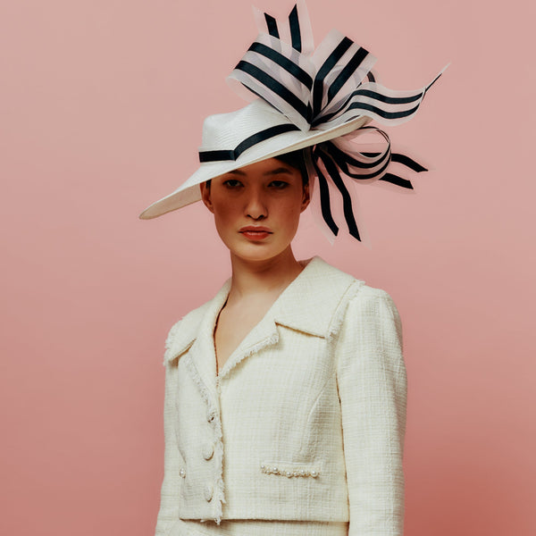 white straw slice fedora with black and white bow