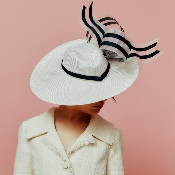 white straw slice fedora with black and white bow