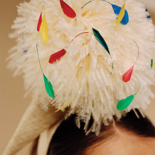close-up of ostrich pom pom ice cream headband with mulit-coloured sprinkle feathers