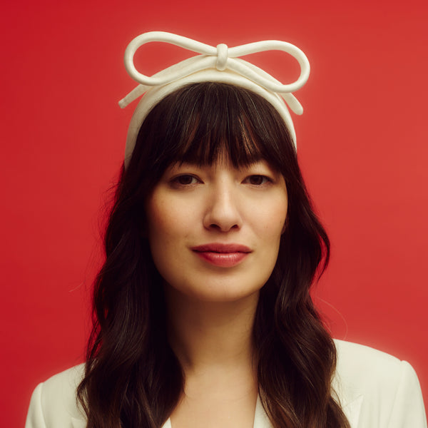 Awon Golding ivory white bridal headband with bow. Front view