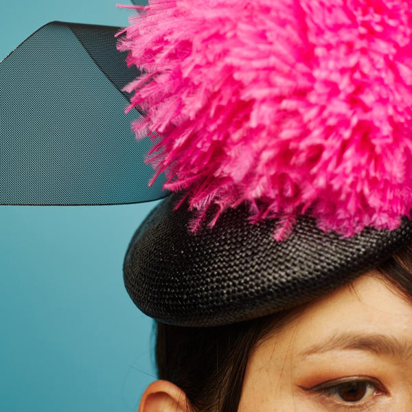 Awon Golding Bal Black and Pink Giant Pom Pom Hat, close up