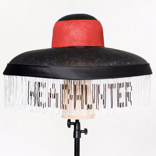 Headhunter - Sinamay & pinokpok wide brim hat with satin bias band and hand-beaded trim. This statement hat features traditional Naga colours.