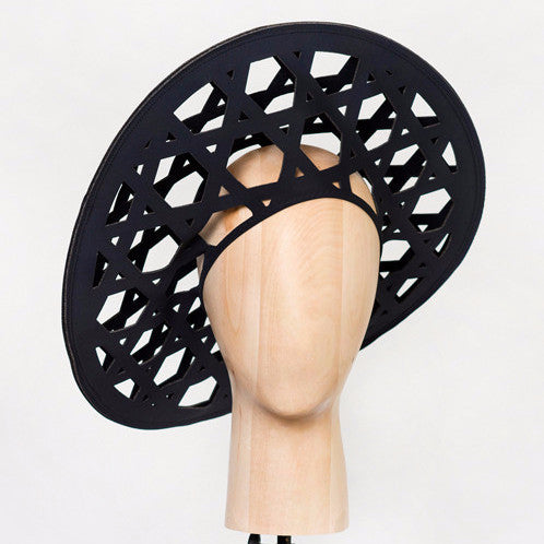 Cane - Based on the weaving pattern of a straw rain hat used in the rice paddy fields of Nagaland, this laser-cut geometric neoprene beret creates a striking silhouette.