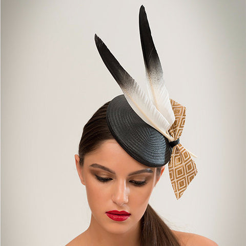 Ash - This black straw disc with goose feathers and geo-woven gold fabric bow is a crowd-pleaser that goes with almost anything.