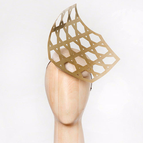 Kohima- Laser-cut geometric brass on pinokpok base. This is perfect for someone looking to make a bold, modern statement.