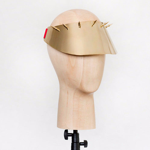 Kuki - Mirror polished brass visor with brass spike detailing. Sports luxe at its finest.