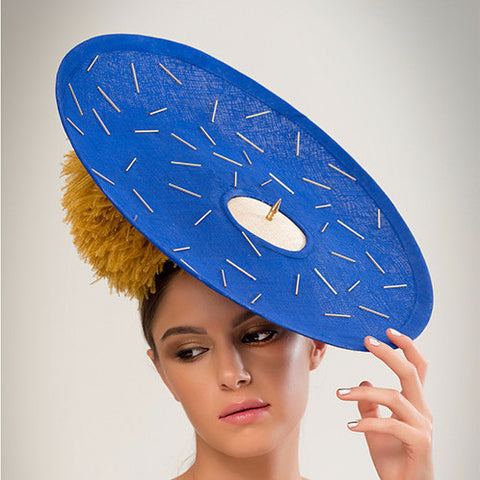 Pitt - Beaded cobalt pinokpok over-sized disc with gold bugle bead detailing, giant ostrich pom pom and single brass spike trim. The perfect Ascot hat.