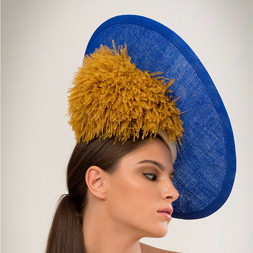 Pitt - Beaded cobalt pinokpok over-sized disc with gold bugle bead detailing, giant ostrich pom pom and single brass spike trim. The perfect Ascot hat.