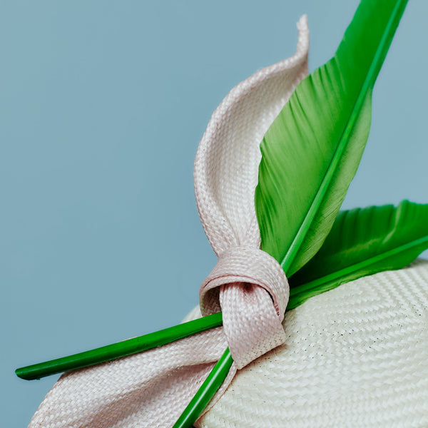 ivory buntal straw beret with pink straw bow and green goose feathers