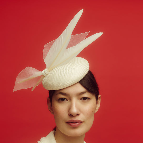 Awon Golding Ivory white straw button hat with two goose feathers and crinoline bow. Modern millinery 
