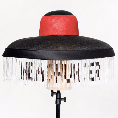 Headhunter - Sinamay & pinokpok wide brim hat with satin bias band and hand-beaded trim. This statement hat features traditional Naga colours. 