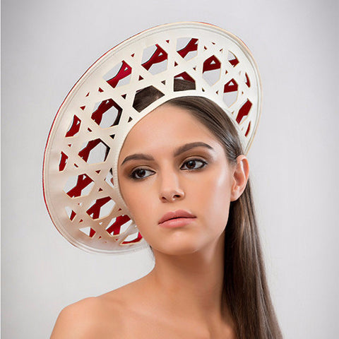 Konyak - This laser-cut two-tone neoprene beret is a chic addition to the modern woman's wardrobe. Best of all, it packs flat! 