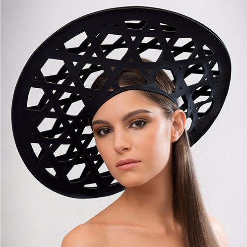 Cane - Based on the weaving pattern of a straw rain hat used in the rice paddy fields of Nagaland, this laser-cut geometric neoprene beret creates a striking silhouette.