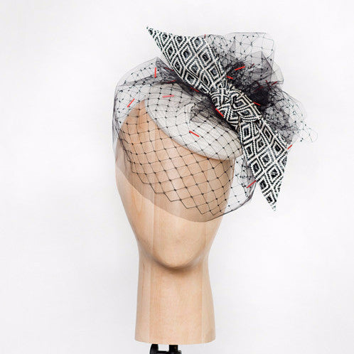 Rivers - White straw disc with geo-woven bow & hand-beaded tulle veil. This hat is both demure and modern. 