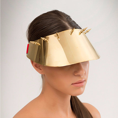 Kuki - Mirror polished brass visor with brass spike detailing. Sports luxe at its finest. 