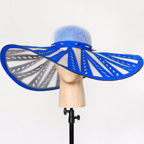 Manipur - Cobalt laser-cut neoprene and crinoline brim sunhat with brass spike trim band, and french net and silk crown. Wear this to the beach or to the races, either way you're making an entrance. 